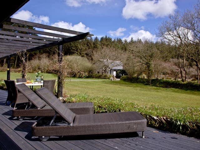 Relax and unwind on the decked area | Rose - Woodland Retreat, Wadebridge