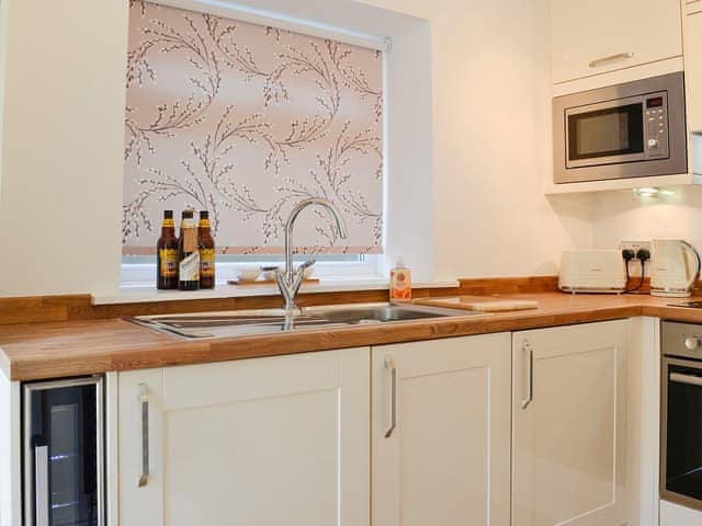 Practical kitchen layout | Ghillie Cottage, Cockermouth