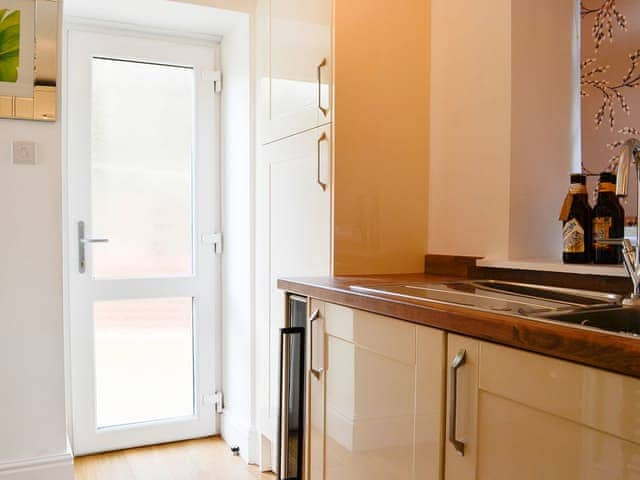 Kitchen with access to the outdoor area | Ghillie Cottage, Cockermouth