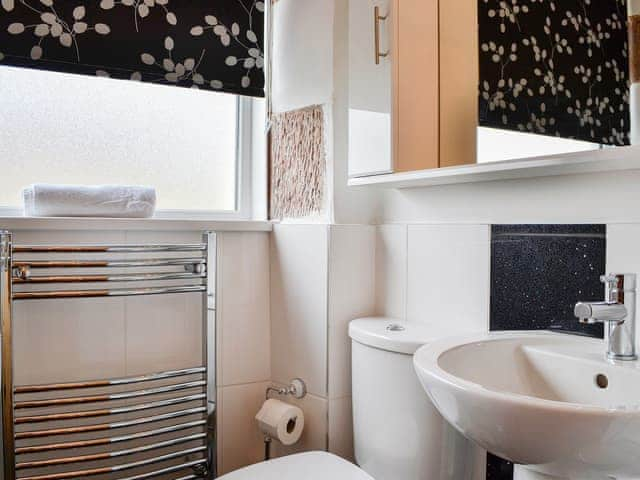 Heated towel rail in the bathroom | Ghillie Cottage, Cockermouth