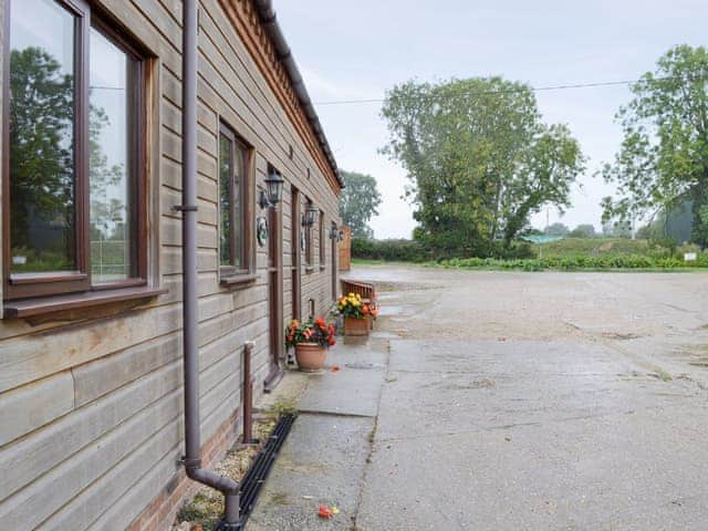 Attractive cottages with large courtyard parking area | Dairy Cottage - Moor Farm Stable Cottages, Foxley, near Fakenham