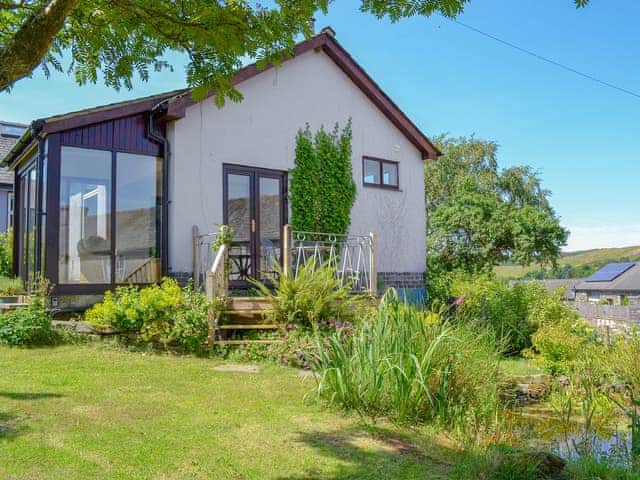 Delightful studio accommodation (unfenced pond in the garden) | Borran Annexe, Oxen Park, near Ulverston