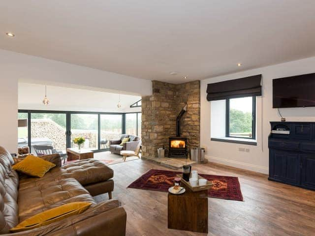 Comfortable living area with wood burner | Moorgate Cottage - Moorgate Farm, Kelbrook, near Barnoldswick