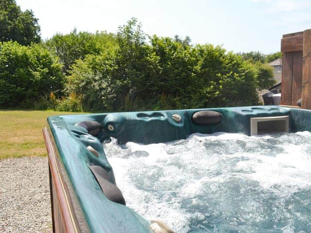 Luxurious hot tub on the patio | Chestnut House - Sherrill Farm Holiday Cottages, Dunterton, near Tavistock