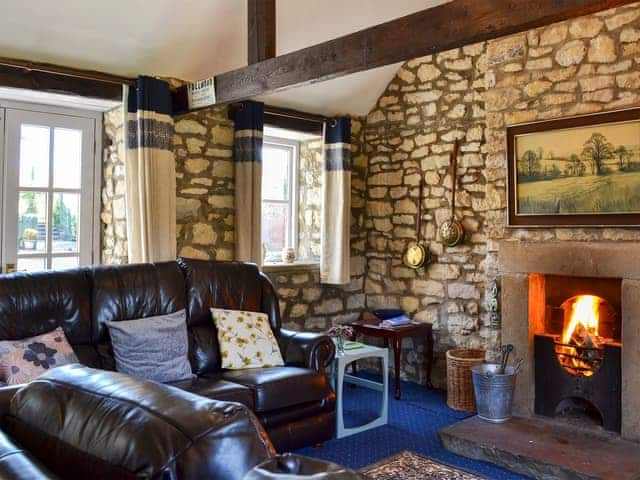 Cosy living room with open fire | Honeysuckle Cottage - Sands Farm Cottages, Wilton near Pickering