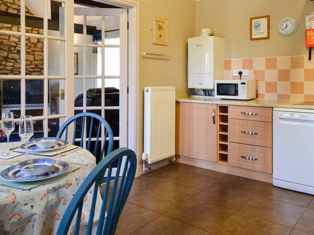 Kitchen and dining area | Honeysuckle Cottage - Sands Farm Cottages, Wilton near Pickering