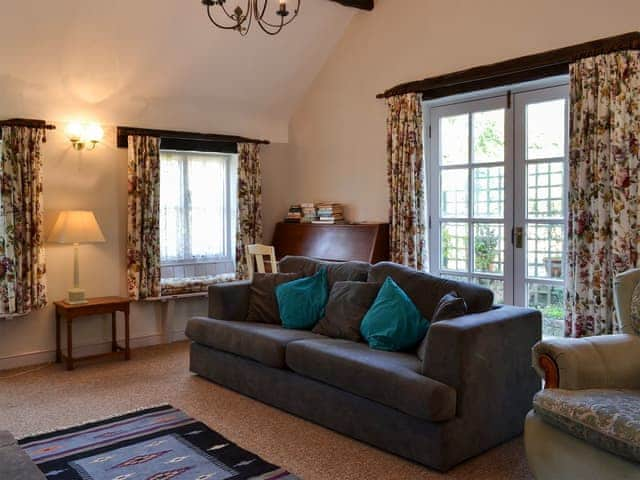 Comfortable living room with oepn fire | Jasmine Cottage - Sands Farm Cottages, Wilton near Pickering