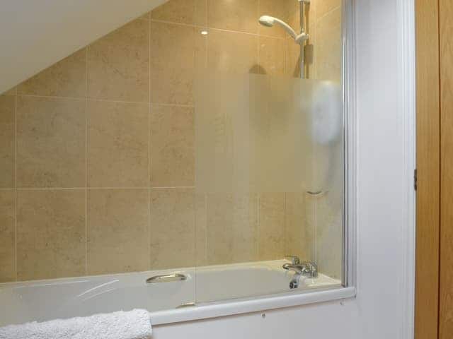 Bathroom with over the bath shower | Swallow Barn, Torpenhow, near Wigton