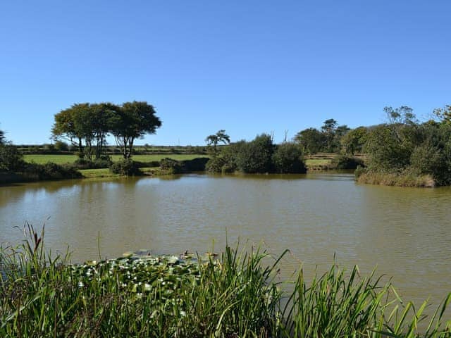 One of the fishing lakes in the grounds available to guests | Heath Farm Cottages - Cowslip, Heath Farm - Old Mill - Heath Farm , Bradworthy, near Hartland