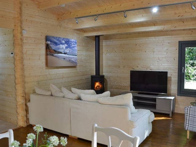 Lounge area with wood burner | Trelispen Lodge, Perran Downs, near Marazion