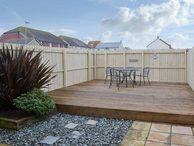 Garden with raised decked area | Sandy Toes, Beadnell, near Alnwick