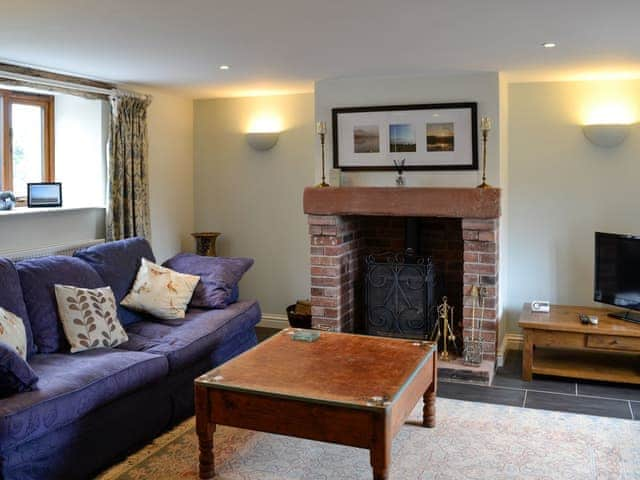 Cosy living room with wood burner | Swallow Barn, Torpenhow, near Wigton