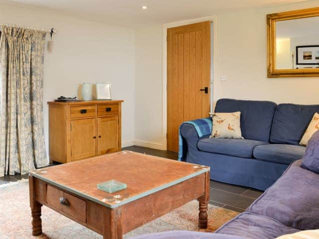 Cosy living room with wood burner | Swallow Barn, Torpenhow, near Wigton