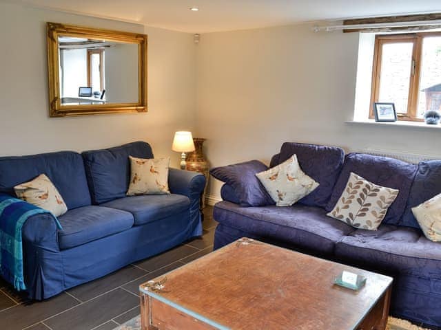 Cosy living room with wood burner | Swallow Barn, Torpenhow, near Wigton