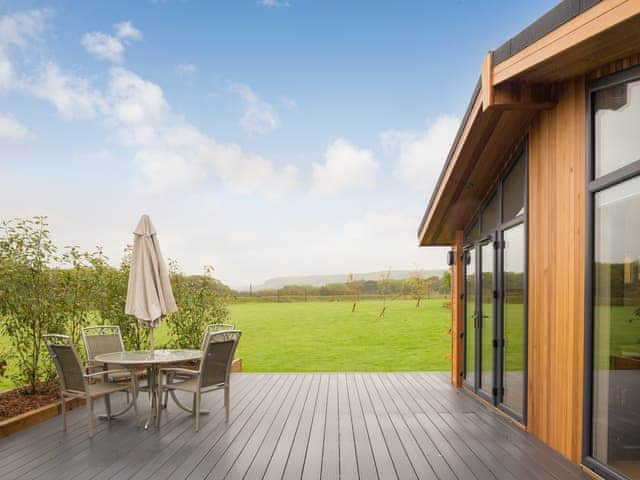 Expansive decked area with far reaching countryside views | Cedar Lodge - South Downs Lodges, Hassocks