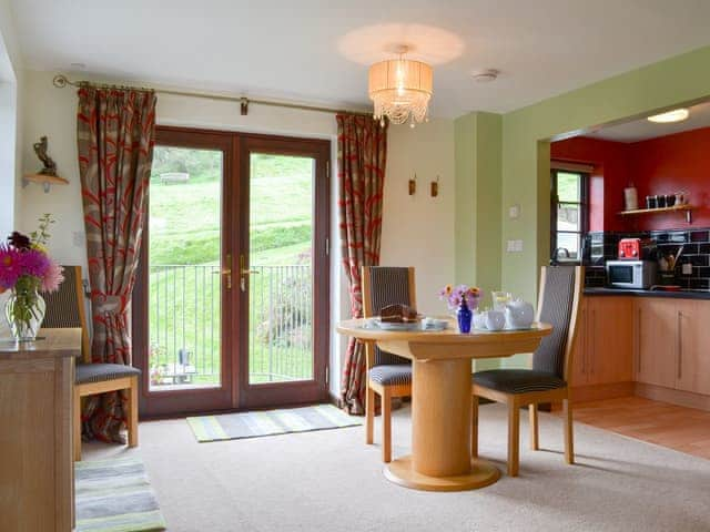 Modest dining area next to the patio doors | Tripp Cottage, St Neot, near Liskeard