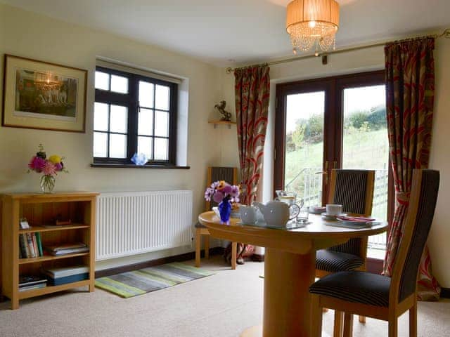 Dining area and access to the garden | Tripp Cottage, St Neot, near Liskeard