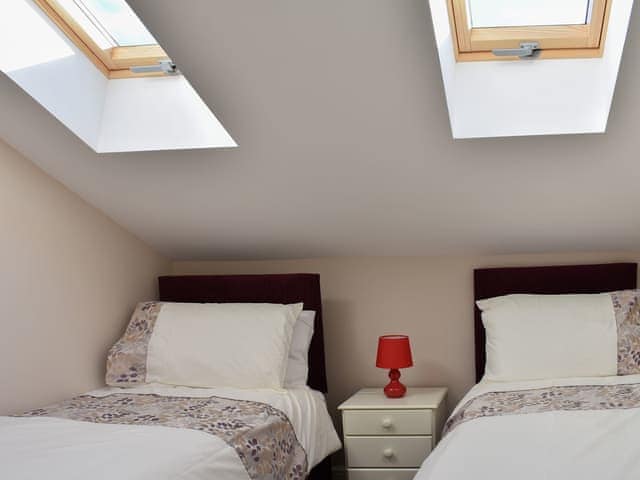 Twin bedded room with Velux windows | Blacksmith&rsquo;s Cottage - Upwey Cottages, Weymouth