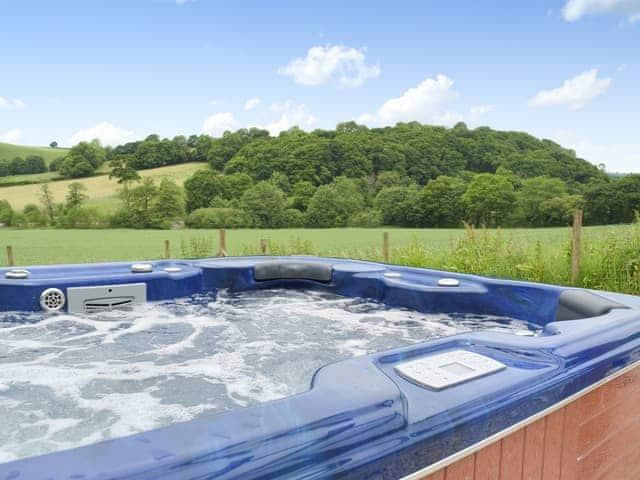 Hot tub | Upper Mill Barn - Pantgwyn Farm Cottages, White Mill, near Carmarthen