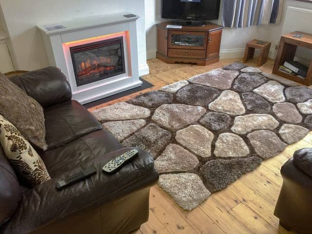 Homely living room with electric fire | Lottie&rsquo;s Place, Seahouses