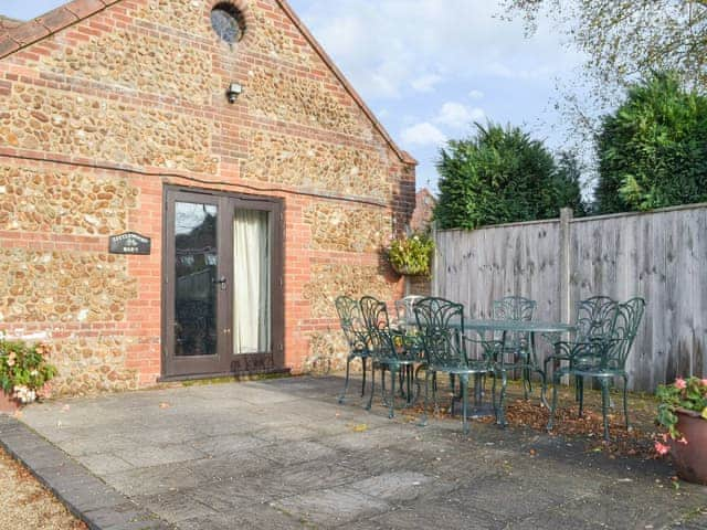 Paved patio area | Littlewoods Barn - Moor Farm Stable Cottages, Foxley, near Fakenham