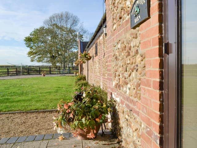 Lawned garden area at front of property | Littlewoods Barn - Moor Farm Stable Cottages, Foxley, near Fakenham