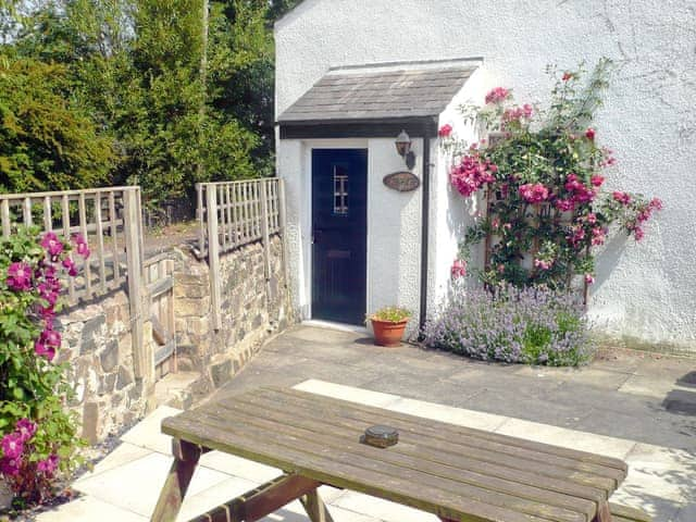 Lovely and peaceful decked area with picnic style table and chairs | Larch Cottage, Dunstan, near Alnwick