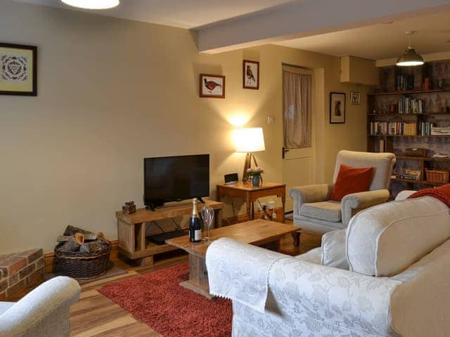 Cosy living room with TV | Little WarhamLittle Warham Cottage, Beaford, near Torrington