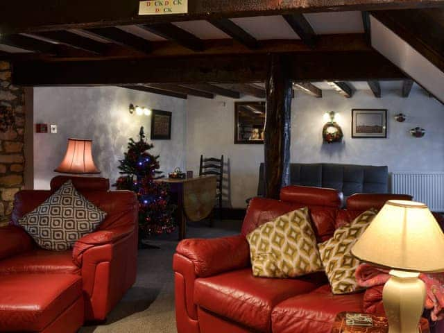 Living room with festive decorations | Poppy Cottage - Sands Farm Cottages, Wilton near Pickering