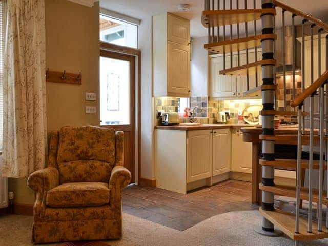 Kitchen area with spiral staicase | Peg&rsquo;s Place, Bowness-on-Windermere