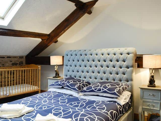 Relaxing first floor double bedroom with cot | Doddick Chase Cottage - Doddick Farm Cottages, Threlkeld, near Keswick