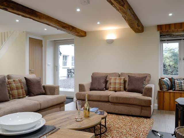 Comfy seating within the living area | Tarn Rigg Cottage - Ormathwaite Farm Cottages, Underskiddaw, near Keswick