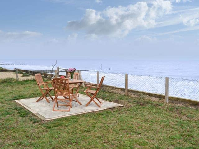 Small paved patio area overlooking the sea | Sea Drift, Walcott, near Happisburgh