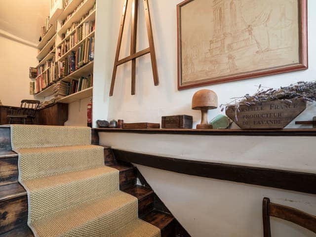 Stairs and library area | The Old Priory Cottage, Dunster, near Minehead
