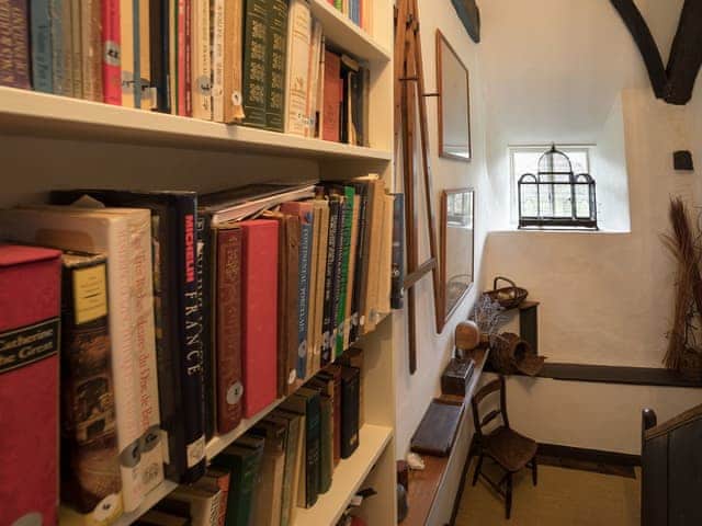 Small library area | The Old Priory Cottage, Dunster, near Minehead