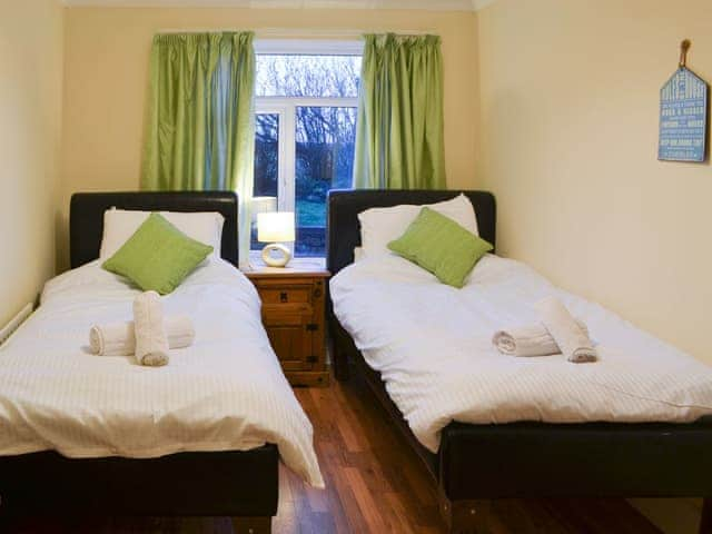 Twin bedroom with en-suite shower room | Dove Cottage - Railway Cottages, Acklington, near Amble