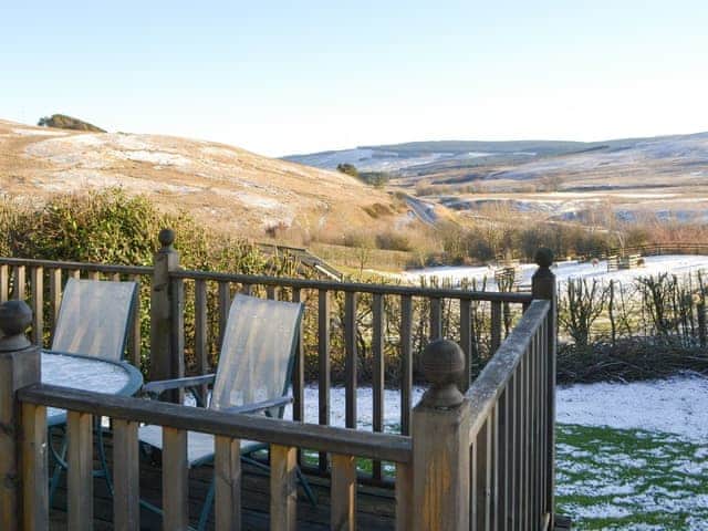 Dramatic winter scenery viewed from the terrace | Rowan Cottage - Whitelee Farm, Bryness, near Otterburn