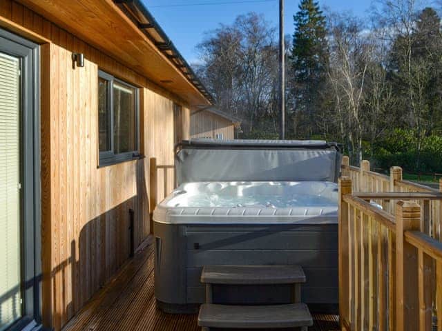 Decked terrace with hot tub | Juniper Lodge - Otterburn Hall Lodges, Otterburn, near Bellingham