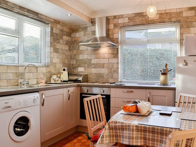 Beautifully tiled kitchen with dining area | Briar Bank Bungalow, Cockermouth