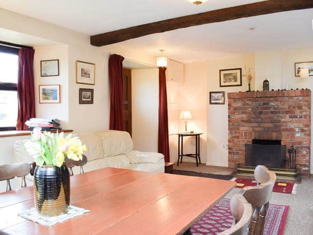 Living/dining room with feature fireplace | The Blacksmith Shop, Shorwell