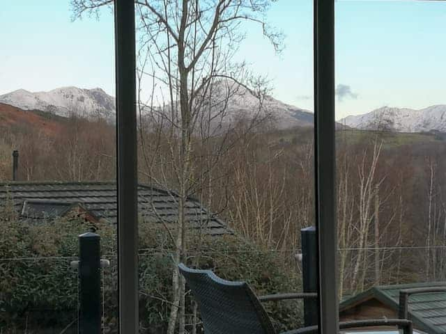 View of Coniston Old Man and Dow Crag from the lounge | Lake Bank Lodge, Water Yeat, near Coniston