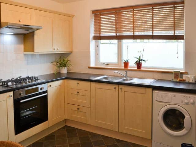 Well appointed kitchen with laundry facilities | Beachcomber Cottage, Newbiggin-by-the-Sea, near Morpeth