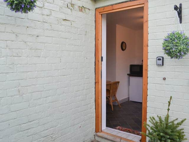 Bright and cheerful entrance direct into the kitchen | Beachcomber Cottage, Newbiggin-by-the-Sea, near Morpeth