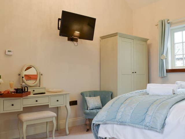 Wall-mounted TV in double bedroom | Owl Cottage - Holtby Grange Cottages, Holtby, near York