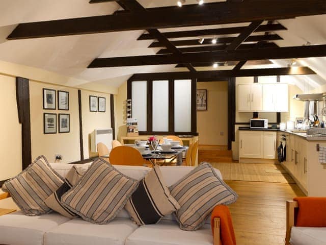 Spacious, beamed open-plan living space | The Byre - Combe Hill Farm, Ninfield, near Battle