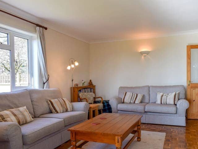 Cosy living room with wood burner | Sea View Lodge, Rousdon, near Lyme Regis