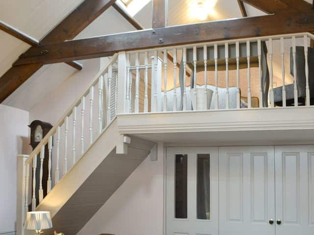 Mezzanine area with exposed wooden beams | The Old Telephone Exchange, Rothbury