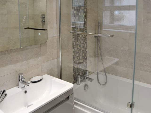 Family bathroom with shower over bath | The Old Telephone Exchange, Rothbury