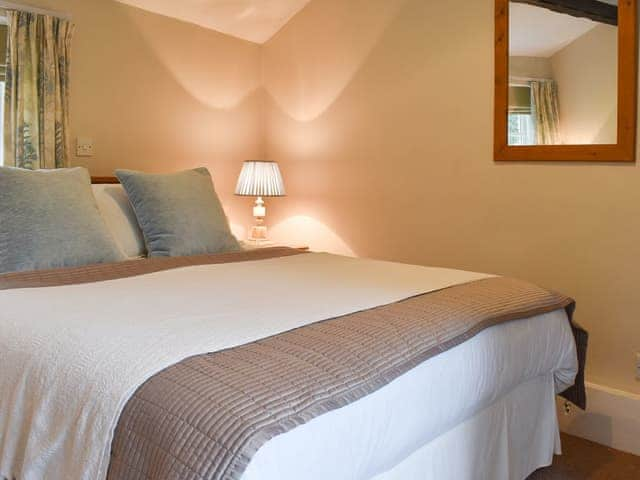 Welcoming bedroom with large bed | The Farriers - The Abbey Coach House, St. Mary&rsquo;s Park, Windermere