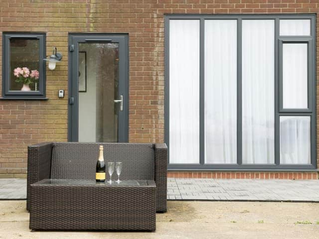 Stylish wicker furniture outside | The Fox - High Oak Holidays, Wicklewood, near Wymondham